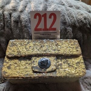 Lot 212 This Apt. 9 brand handbag is a gold sequin crossbody clutch.